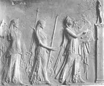 Apollo, Artemis and Leto in procession.  Marble relief in the Louvre