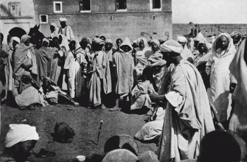 GROUP AROUND PERFORMERS, MARRÃKESH.