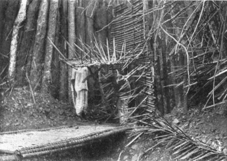 THE GATE CLOSED, WITH WICKET OPEN AND DRAWBRIDGE
LOWERED.