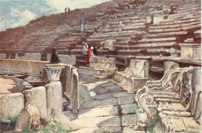 THE LOWER PART OF THE AUDITORIUM OF THE THEATRE OF
DIONYSOS AT ATHENS

Beginning at the left hand below, we notice first the breast-wall
dividing the orchestra from the auditorium, and below it again the
partially covered channel for rain-water. In the foremost row of marble
seats or thrones, the third seat to the right is that of the Priest of
Dionysos, distinguished by the exquisite relief, on the arm of the
throne, of Eros engaged in cock-fighting. Higher up in the auditorium
are pedestals for honorary statues.