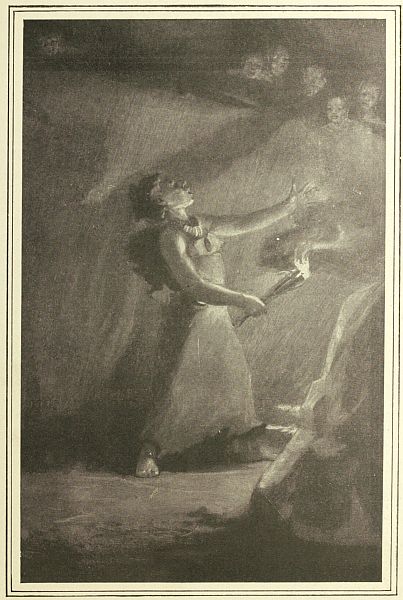 person in cave by fire