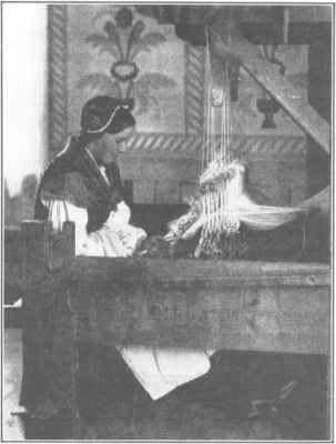 
A YOUNG WEAVER AT THE FAMOUS SÄTERGLANTANS WEAVING SCHOOL IN
DALECARLIA