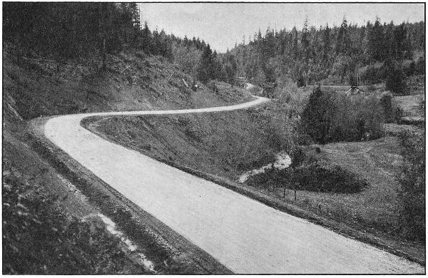 THE PACIFIC HIGHWAY IN PASS
CREEK CANYON, DOUGLAS COUNTY. GRADED AND MACADAMIZED IN 1917 AND 1918