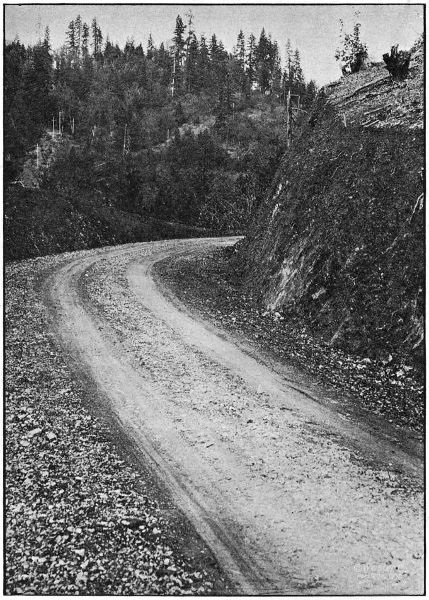 ON THE WOLF CREEK-GRAVE
CREEK SECTION OF THE PACIFIC HIGHWAY IN JOSEPHINE COUNTY. GRADED IN 1918