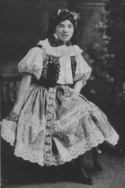 IT'S A LONG WAY FROM THIS ELABORATE CZECHO-SLOVAK COSTUME TO THE
MODERN AMERICAN STYLES